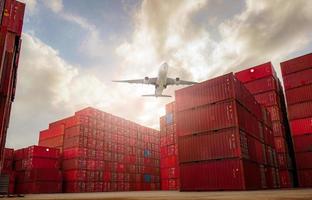 Airplane flying above container logistic. Container crisis. Freight transportation. Logistic industry. Container ship for export logistics. Container at the harbor for truck transport. Air transport. photo
