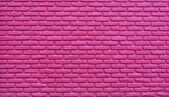 Pink brick wall abstract background. Pink rough brick wall texture. Background for love and Valentine's day. Brick wall wallpaper with copy space. Interior or exterior architecture design for lady. photo