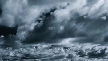 Gray and white cloud abstract background. Sad, dead, hopeless, and despair background. Thunder and storm concept. Gray sky and fluffy clouds. Unlucky day concept. Sad and moody sky. Nature background. photo