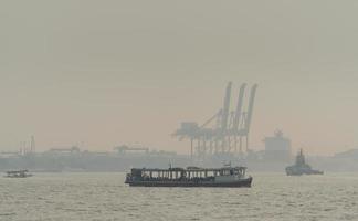 Air pollution at the pier. Bad air quality filled with dust causes of respiratory diseases. Global warming from air pollution problem. Environmental problem from gas carbon monoxide and dust. PM 2.5 photo