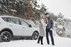 Happy together. Lovely couple have weekend at countryside at winter time photo