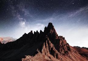 Clouds far away. Photo of the big dolomite mountains. Majestic view. Milky way is in the sky