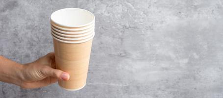 Eco friendly food packaging or takeaway coffee cup. Hand holding natural container for to go. zero waste, pollution, earth day, free plastic, world Environment day concept photo