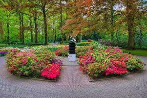 Monument among pink flowers, Keukenhof Park, Lisse in Holland