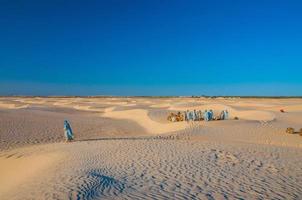 People and camels in Sahara desert, Tunisia, North Africa photo