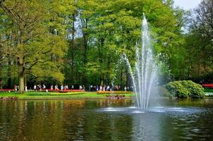 Fontain in the river in Keukenhof park in Holland photo