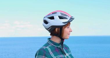 Young woman bicycle rider in sunny summer day video