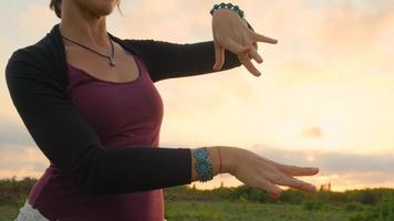 Happy female dance in the summer fields during beautiful sunset video