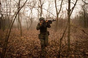 soldiers in the autumn forest photo