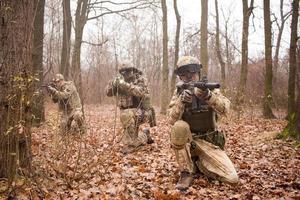 soldiers in the autumn forest photo