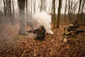 soldiers in the autumn forest photo