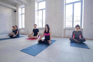 yoga class training, morning exercises in white interior photo