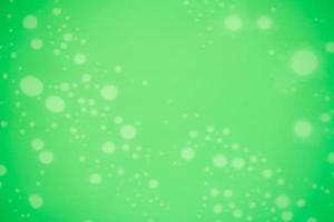 Blurred green texture background with white dotted pattern. Christmas background with copy space for text photo