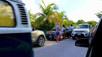 Tulum Quintana Roo Mexico 2018 Typical colorful street road traffic cars palms of Tulum Mexico.