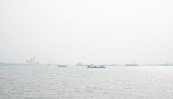 Air pollution at the pier. Bad air quality filled with dust causes of respiratory diseases. Global warming from air pollution problem. Environmental problem from gas carbon monoxide and dust. PM 2.5 photo