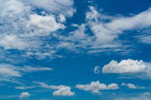 Beautiful blue sky and white cumulus clouds abstract background. Cloudscape background. Blue sky and fluffy white clouds on sunny day. Nature weather. Bright day sky for happy day background. photo