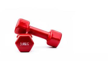 Two red dumbbells isolated on white background with copy space for text. 3.0 kg dumbbell. Weight training equipment. Bodybuilding workout accessories. Healthy lifestyle concept. photo