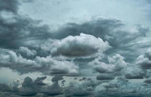 Dark dramatic sky and clouds. Background for death and sad concept. Gray sky and fluffy white clouds. Thunder and storm sky. Sad and moody sky. Nature background. Dead abstract background. Cloudscape. photo