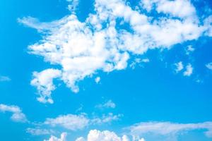 Beautiful blue sky and white cumulus clouds abstract background. Cloudscape background. Blue sky and fluffy white clouds on sunny day. Nature weather. Bright day sky for happy day background. photo