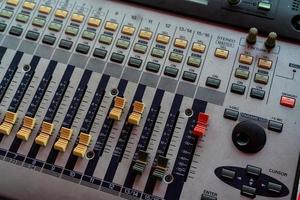 Audio sound mixer console. Sound mixing desk. Music mixer control panel in recording studio. Audio mixing console with faders and adjusting knob. Sound engineer. Sound mixer control radio broadcasting