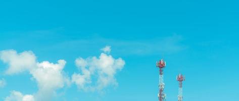 Telecommunication tower with blue sky and white clouds. Radio and satellite pole. Communication technology. Telecommunication industry. Mobile or telecom 4g and 5g network. Telecommunication pylon. photo