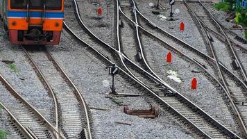 Train track and traffic sign between railway. Journey by train. Local transportation. Travel on summer by train. Junction of railroad track. Transportation industrial. Way of life concept photo