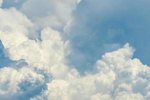 Beautiful white fluffy cloud abstract background. Cloudscape.  Fluffy white clouds on sunny day. Nature weather. Soft like cotton texture of cloud. Puffy clouds. Wish and peaceful concept. Sunshine. photo