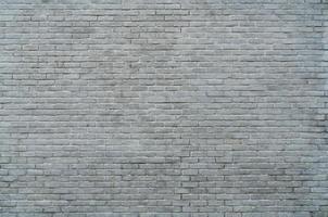 White and grey brick wall texture background with space for text. White bricks wallpaper. Home interior decoration. Architecture concept. Background for sad, hopeless and despair concept. photo