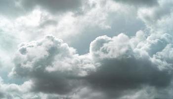 Overcast sky. Dark dramatic gray sky and white clouds before rain. Cloudy and moody sky. Storm sky. Cloudscape. Gloomy and moody background. Overcast clouds. Background for sad, lonely, and hopeless. photo