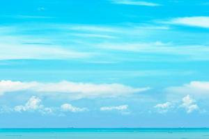 Beautiful blue sky blue sea water and white clouds on sunny day. Cloudscape. Transport ship in the sea. Soft color of pastel blue sky and fluffy clouds. Peace, relax mind and romantic background.