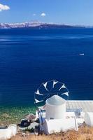 View on windmill and Aegean sea from Therasia island, Santorini, Greece. photo