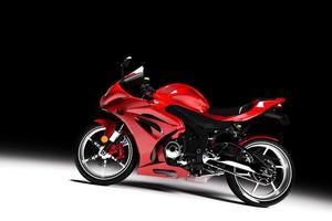 Side view of red sports motorcycle in a spotlight photo