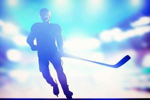 Hockey player skating on ice in arena night lights photo