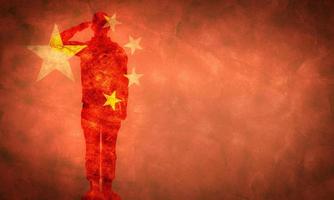 Chinese grunge flag with soldier silhouette. photo