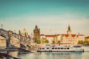 Prague, Czech Republic. Charles Bridge, boat cruise on Vltava river. Vintage photo