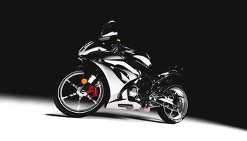 motocicleta deportiva sobre fondo negro. foto