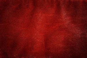 Genuine red leather background, pattern, texture. photo