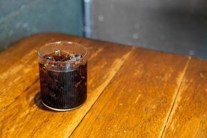 ice cola glass on table photo