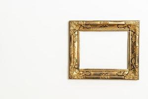 empty picture frame on white wall background photo