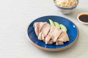 Hainanese chicken rice or rice steamed with chicken soup photo