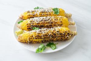 barbecue and grilled corn with cheese and lime photo