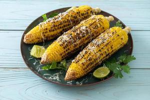 barbecue and grilled corn with cheese and lime photo