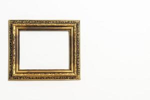 empty picture frame on white wall background photo