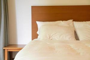 white pillow decoration on bed photo