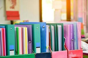 Closeup view of paperwork box for keeping various documents inside which is placed on the table in the office, soft focus. photo