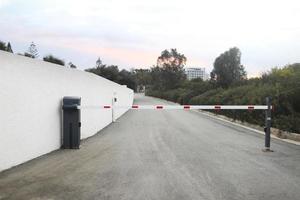 parking barrier system, automatic car park security system. barrier to the closed area of the hotel photo