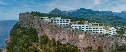 Aerial view of the luxury cliff house hotel on top of the cliff on the island of Mallorca.