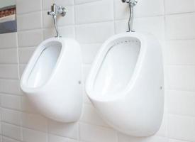 White urinals men in public toilet photo