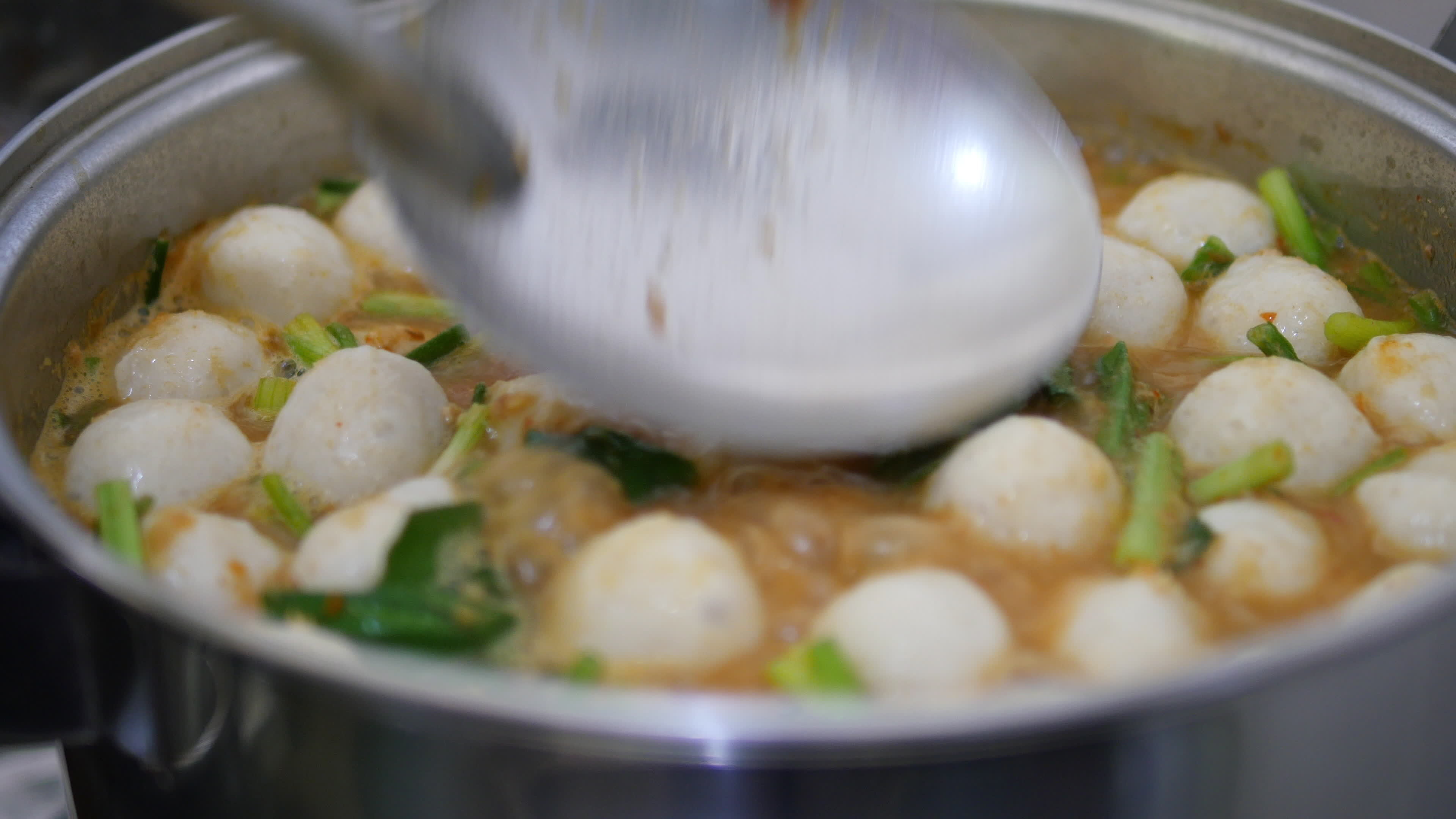 Closeup of preparing or cooking traditional Thai food in kitchen - Thai