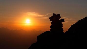 Stacked stones marking the right path of a mountain path photo
